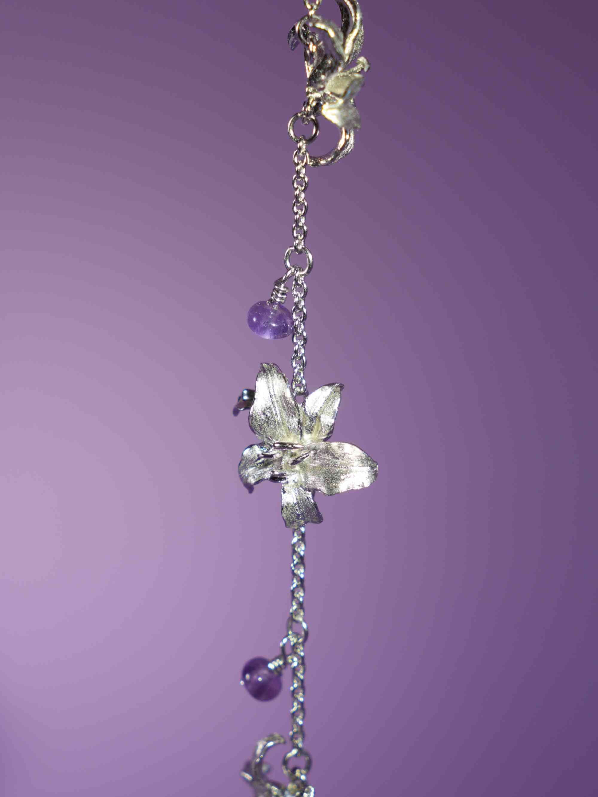Oriental Lily Crystal Bracelet with purple background