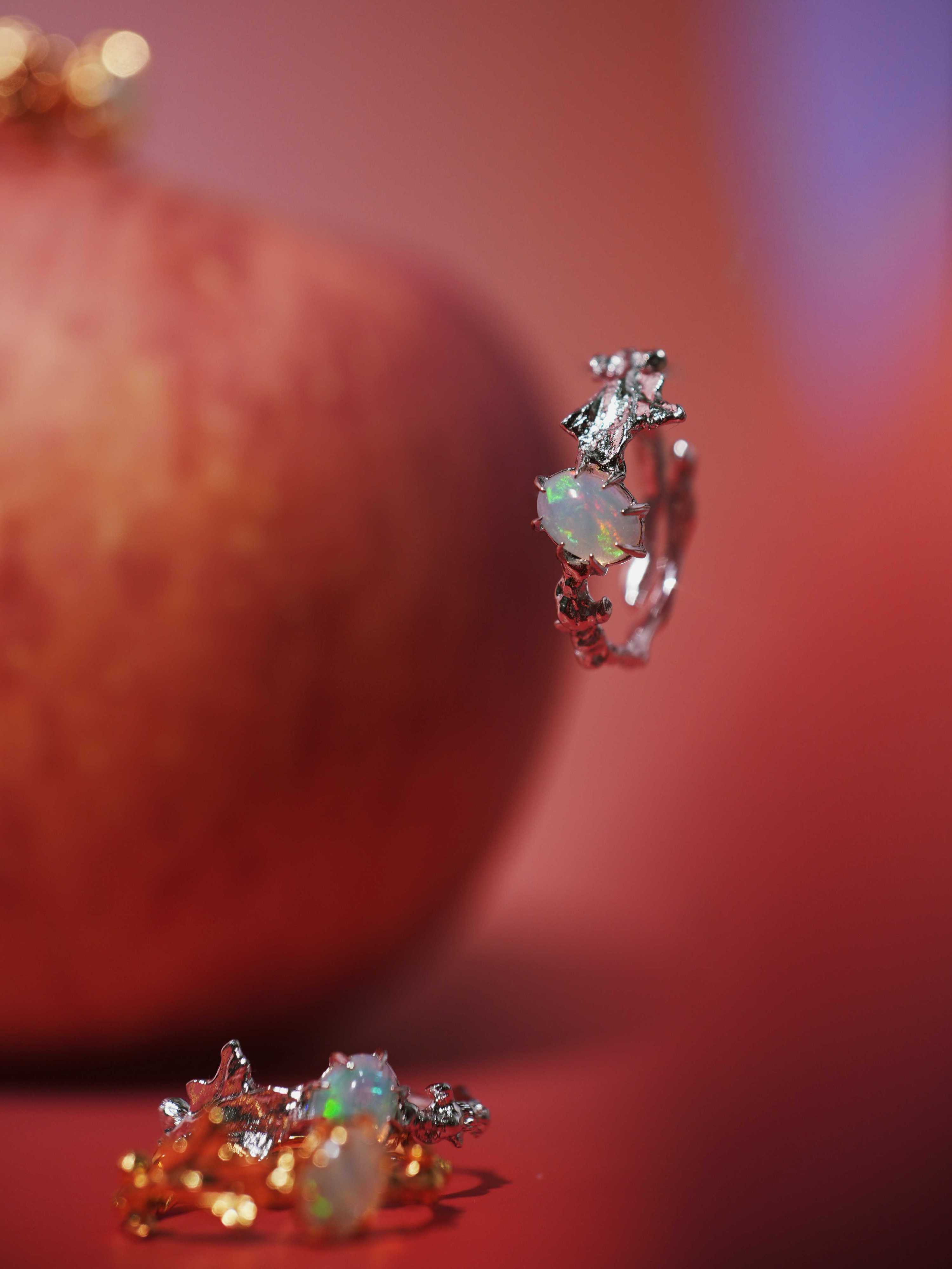 Ranunculus Leaf Opal Ring with apple in the background