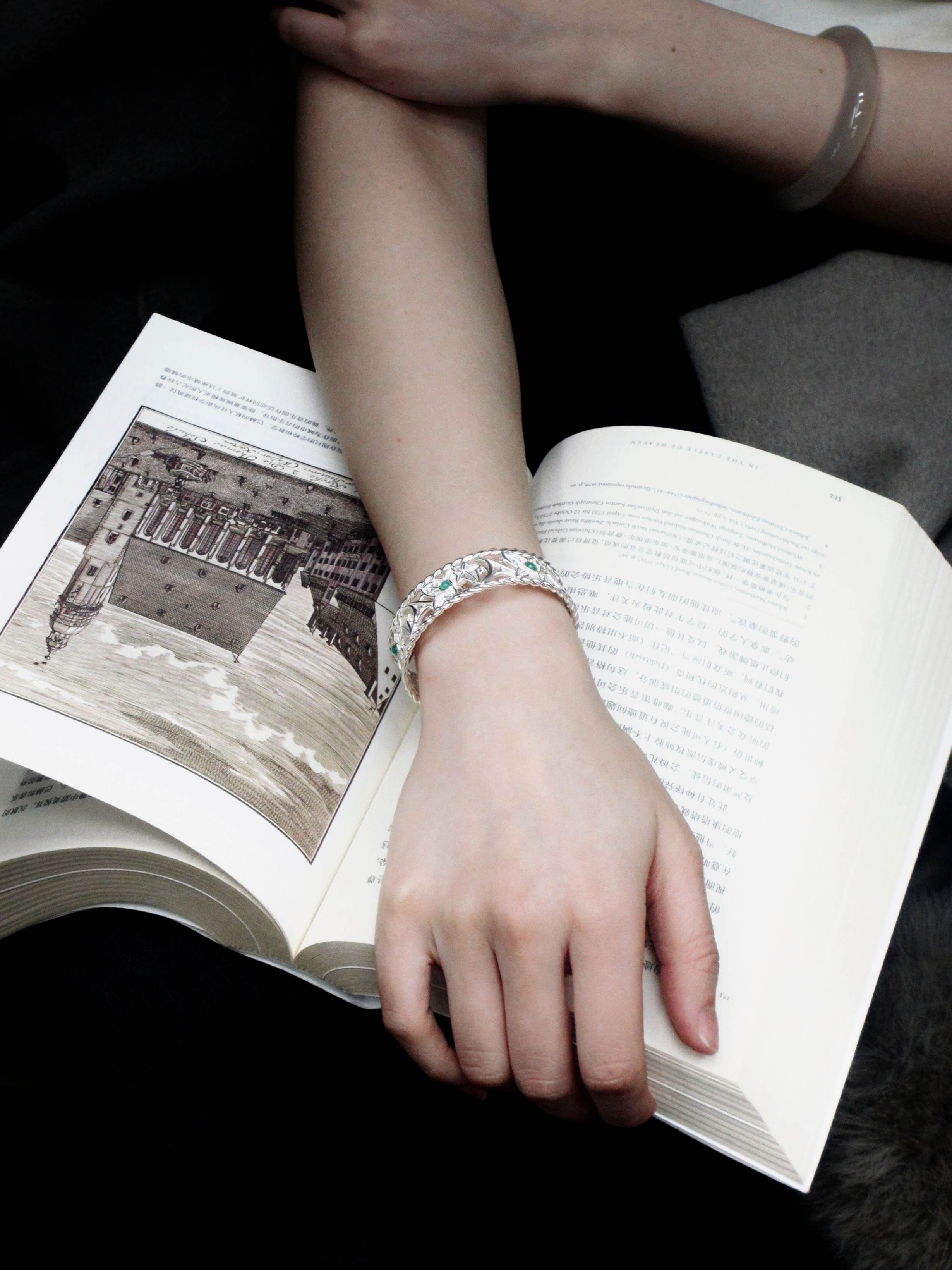 Wearing The Eternal Ivy Openwork Bracelet with Chrysoprase on a afternoon reading a book