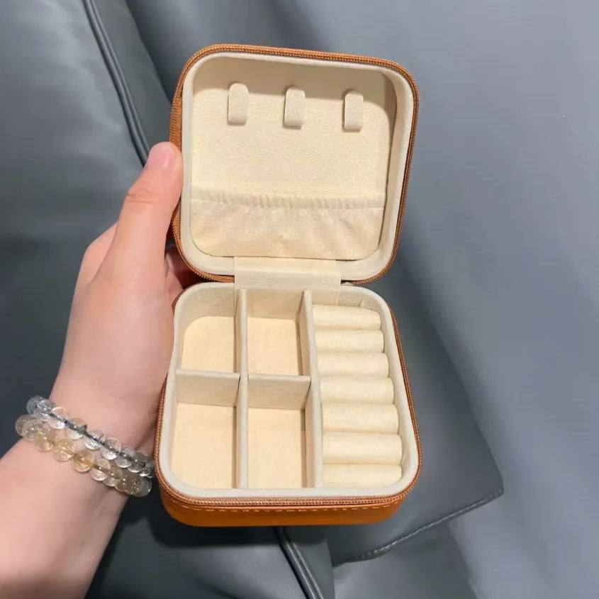 Palm-sized travel jewelry box