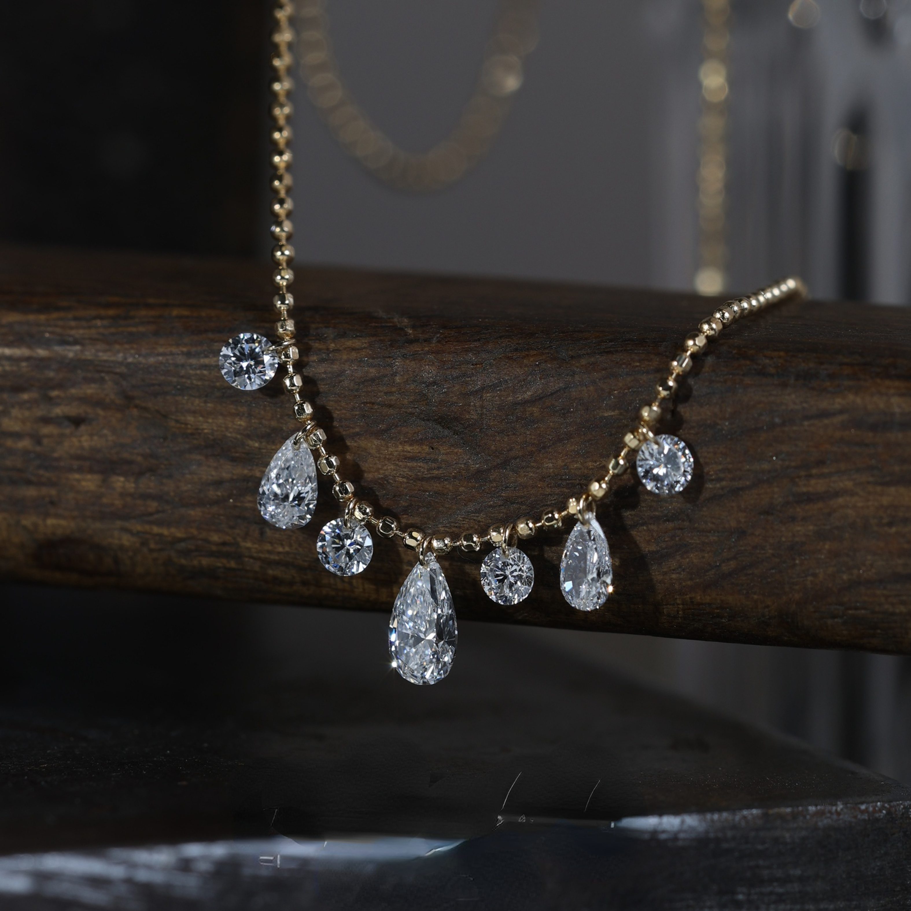 Pear and Round Cut Graduated Floating Diamond Necklace