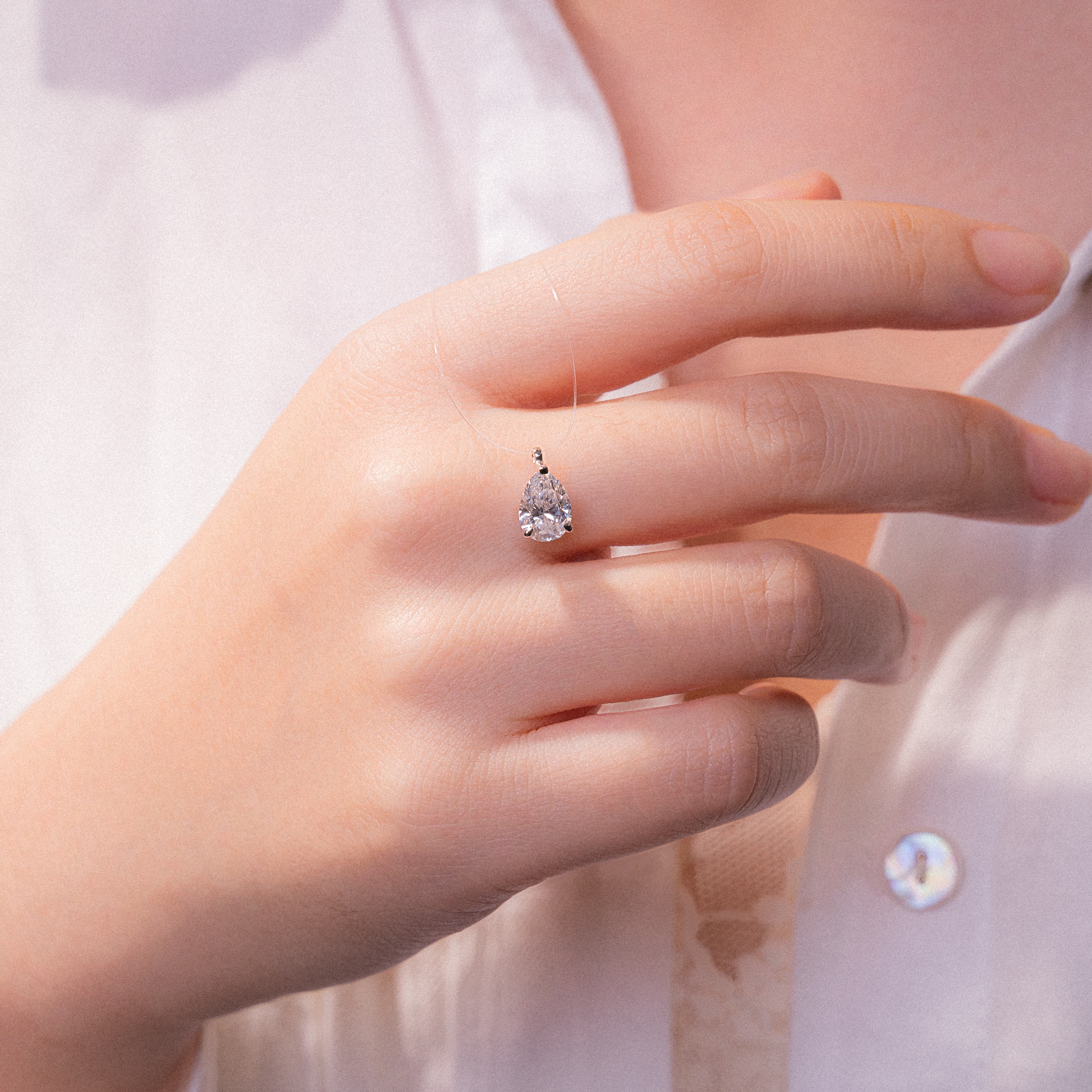 Invisible Chain Pear Cut Solitaire Diamond Pendant Necklace