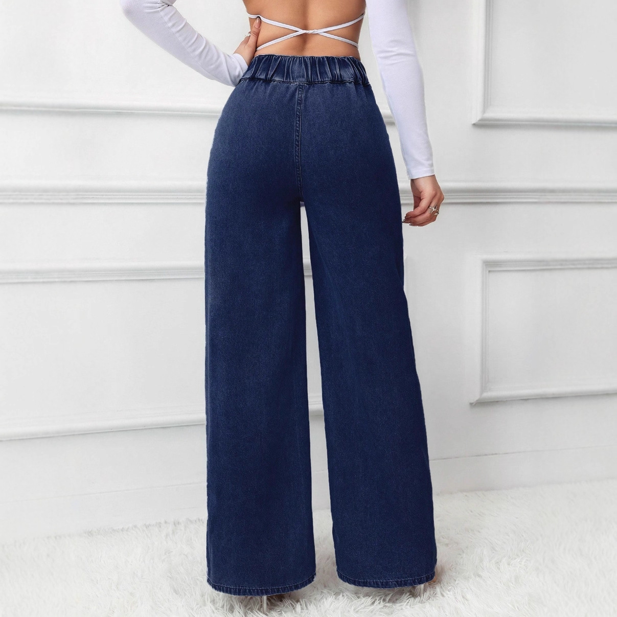 High-waisted wide-leg jeans, retro design.