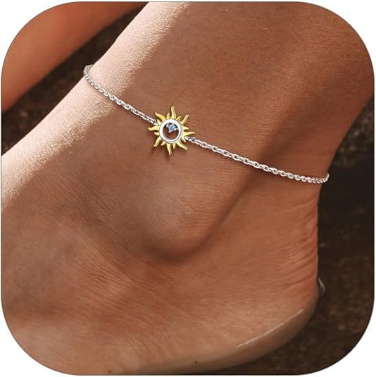 Woman wearing a S925 sterling silver sun charm anklet with blue stone