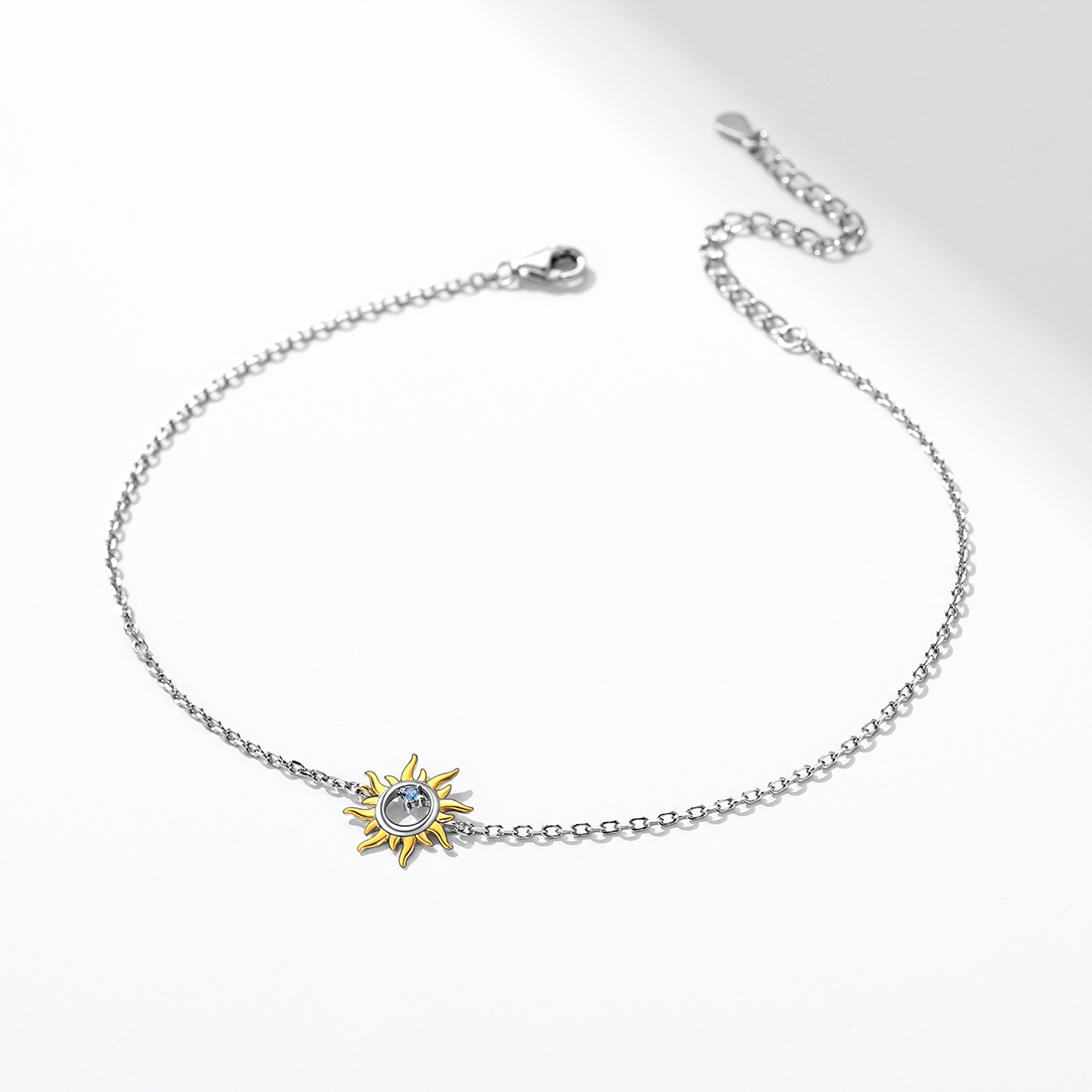Simple display of a silver sun charm ankle bracelet, elegant gift for women