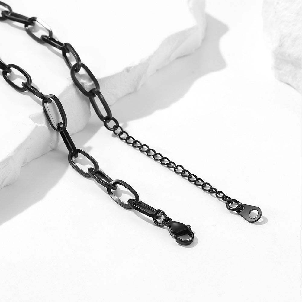 Close-up of clasp and chain details in black chain
