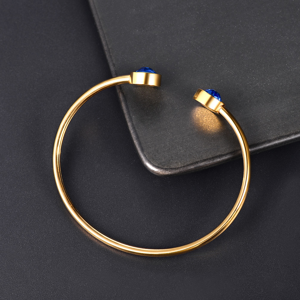 Gold December birthstone bracelet blue tone