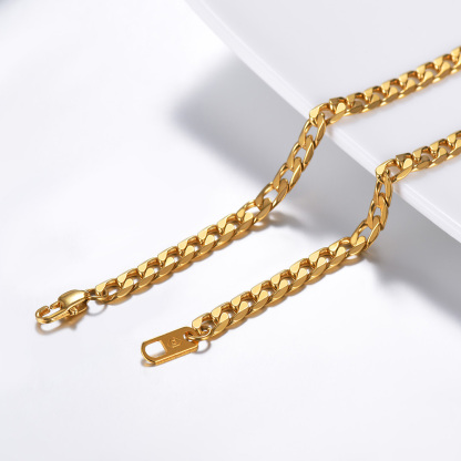 Gold stainless steel Cuban chain necklace flat lay
