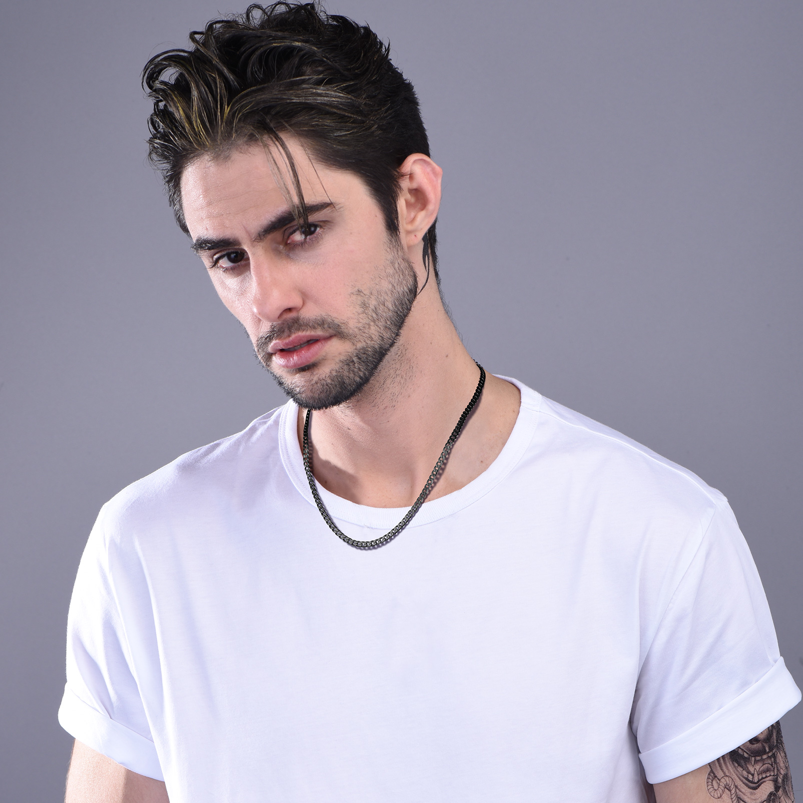 Male model wearing a black stainless steel curb chain necklace