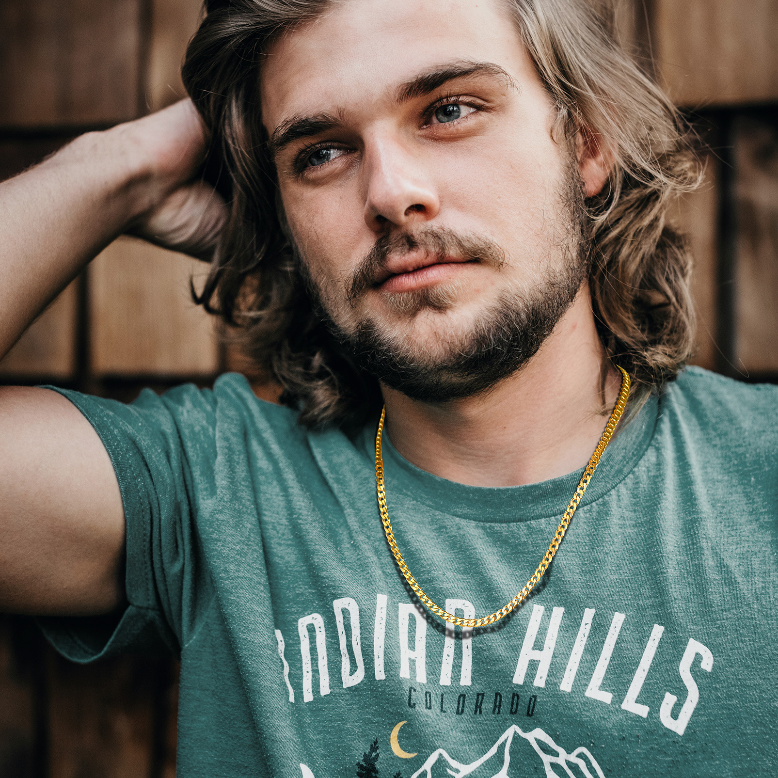 Male model wearing a gold stainless steel curb chain necklace
