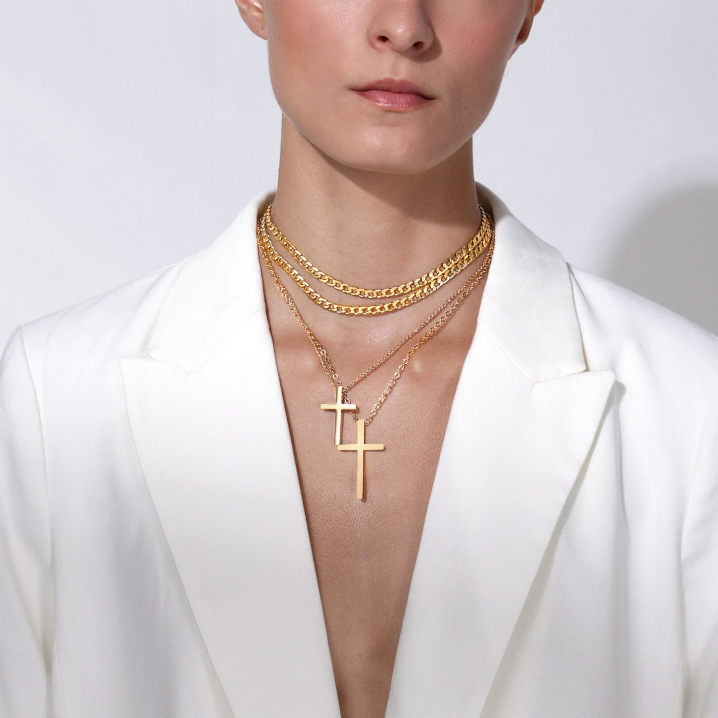Gold cuban chain necklace worn by female model