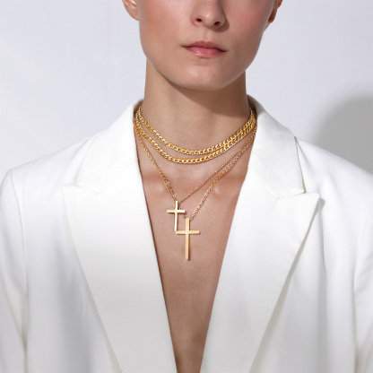 Gold cuban chain necklace worn by female model