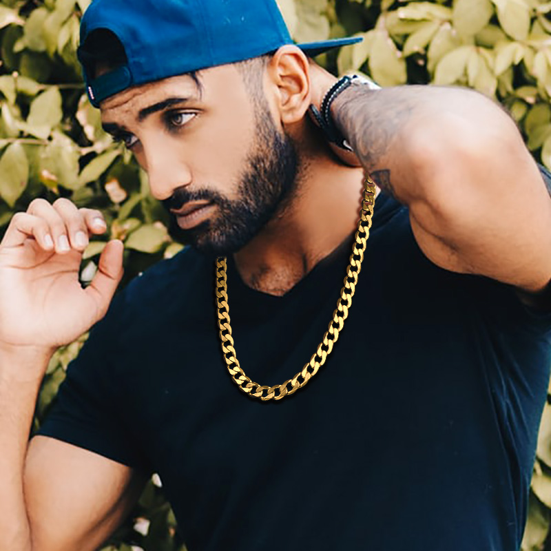 Gold Cuban link chain necklace on male model