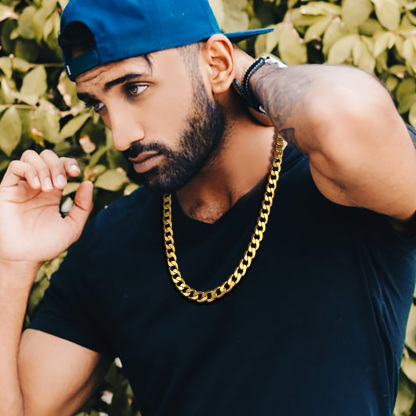 Gold Cuban link chain necklace on male model
