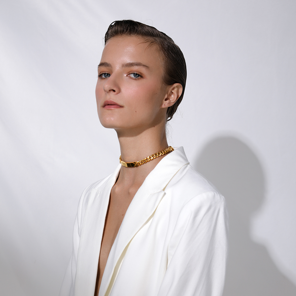 Model wearing gold stainless steel choker necklace