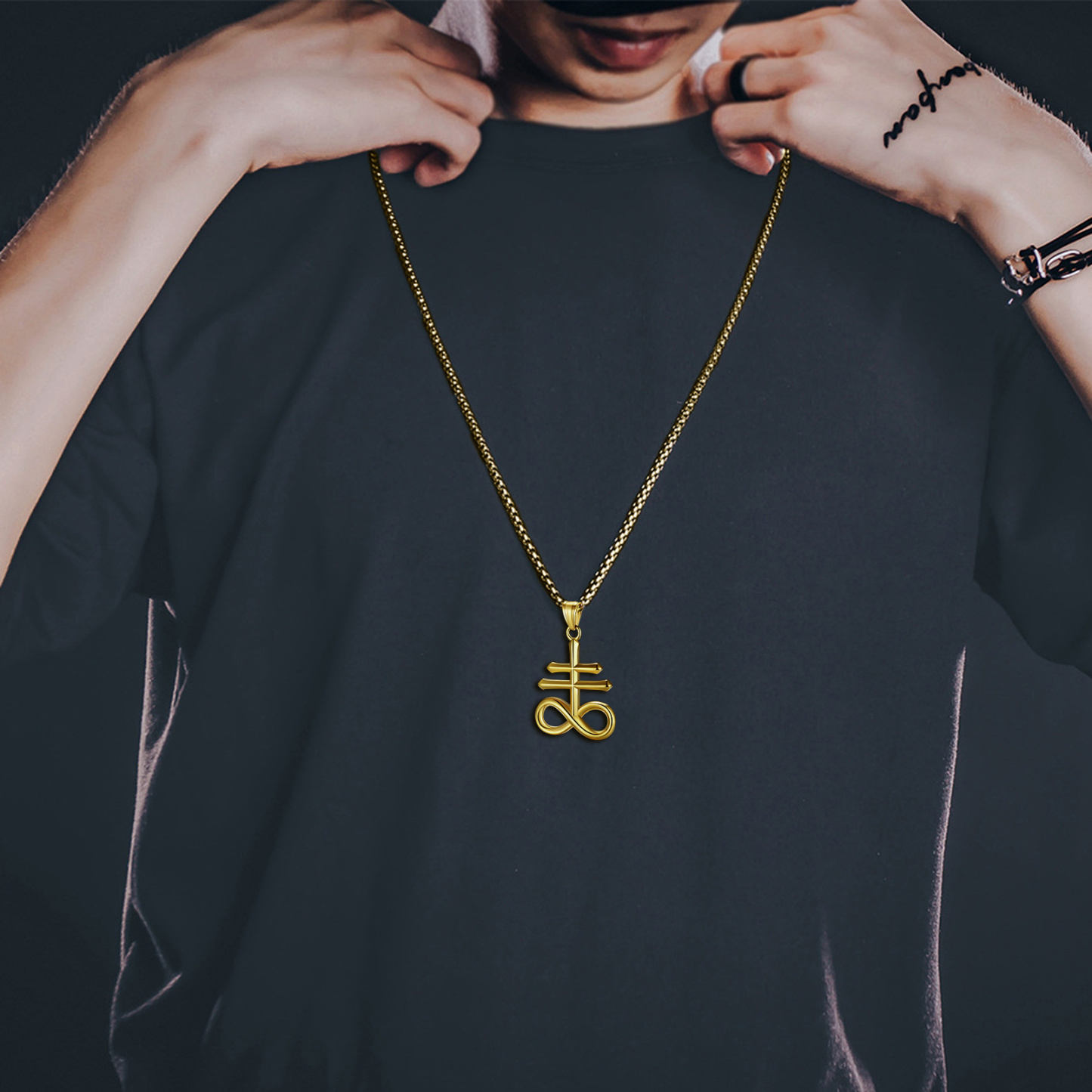 Man wearing gold Leviathan Cross pendant necklace stylish look