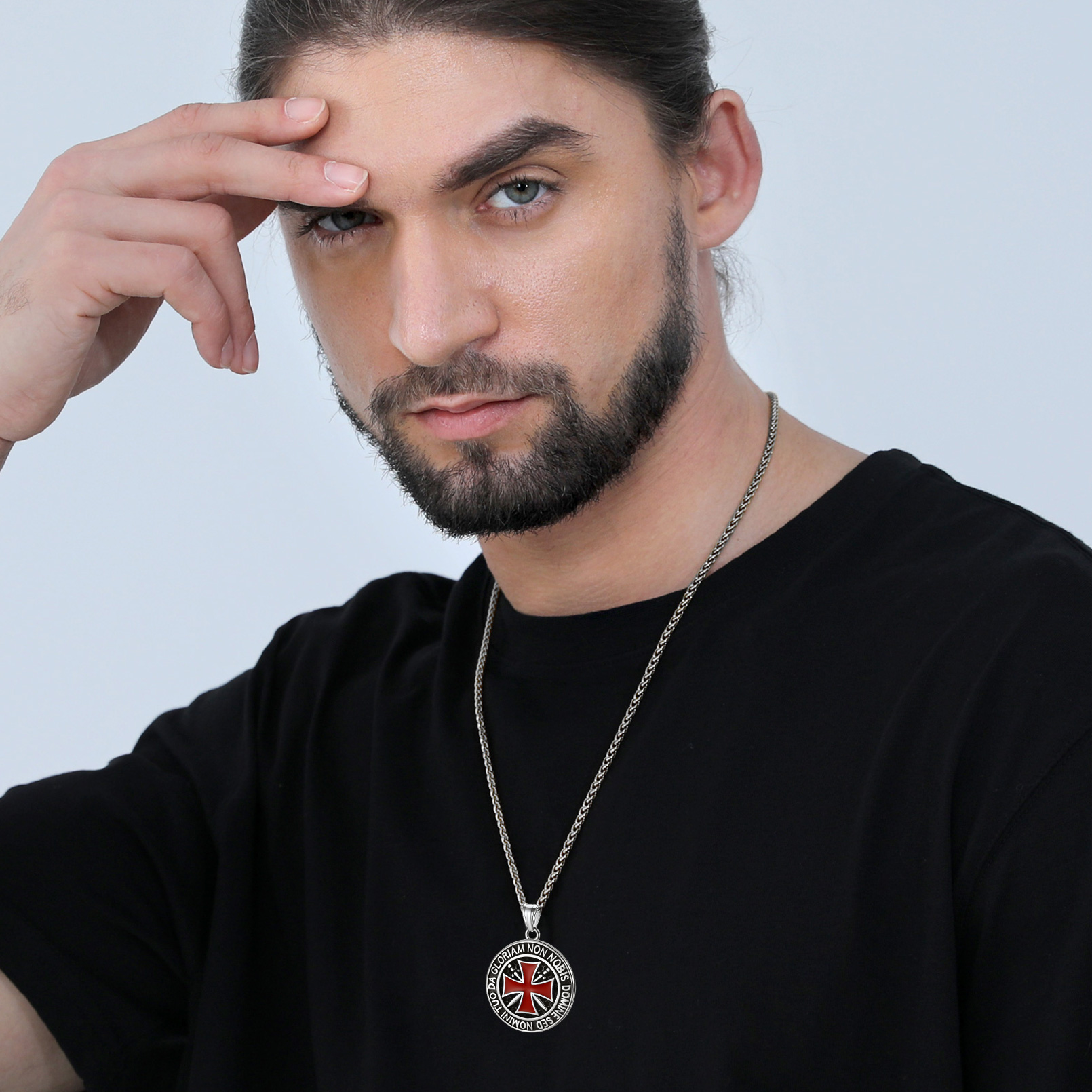 Male model wearing black Templar cross necklace with red cross pendant