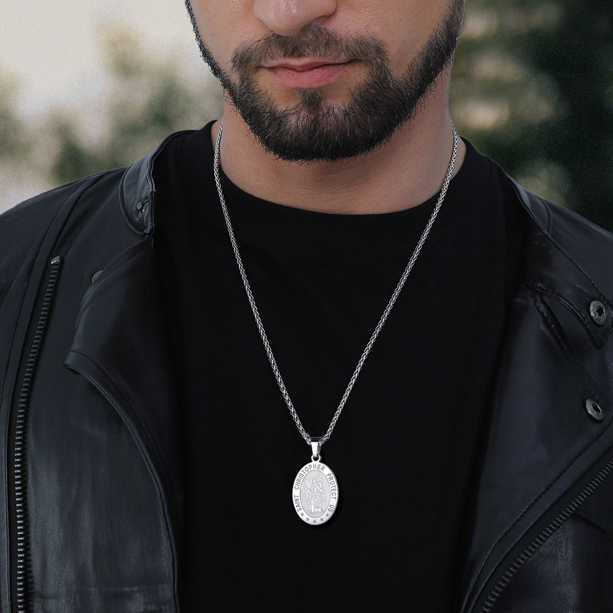 Man wearing Saint Christopher pendant necklace