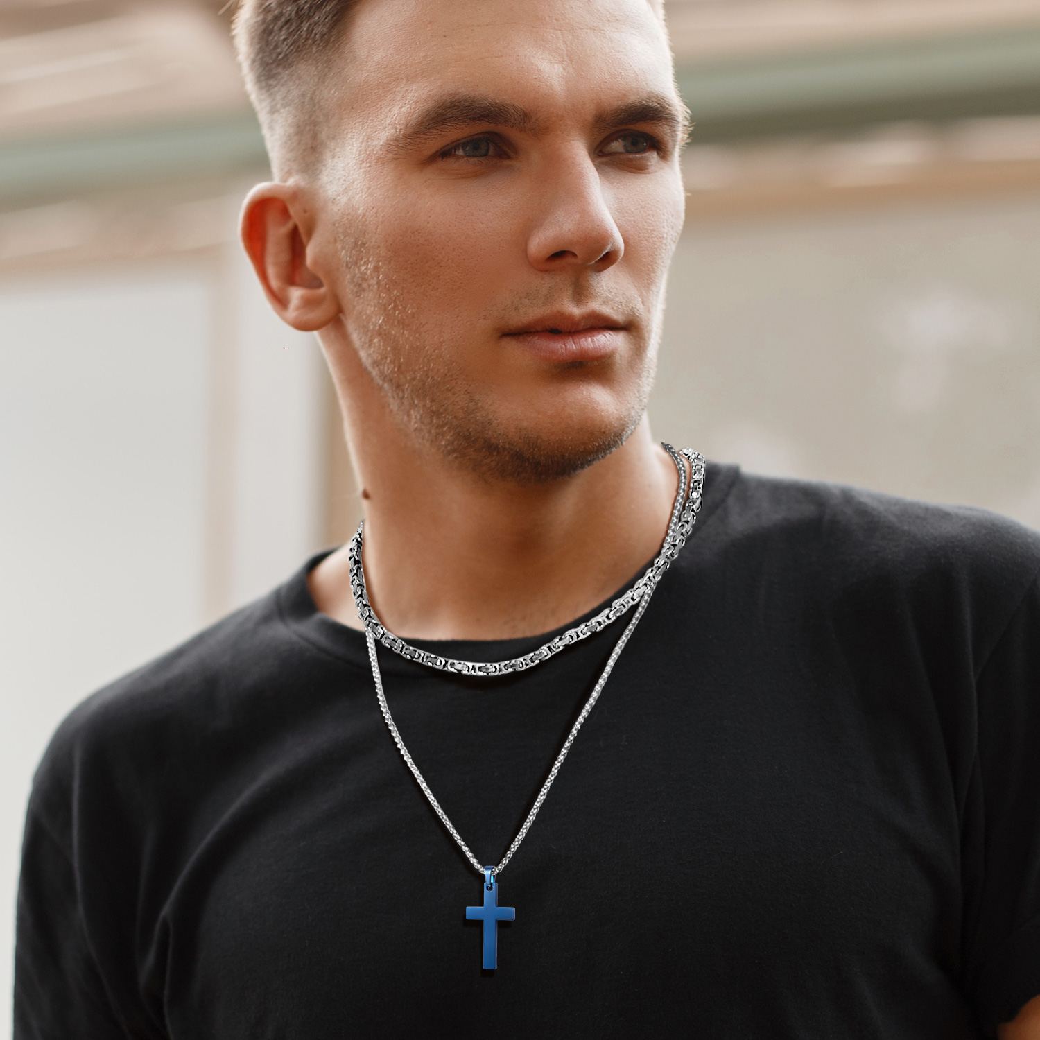 Layered square Byzantine chain necklaces worn by male model for modern street style