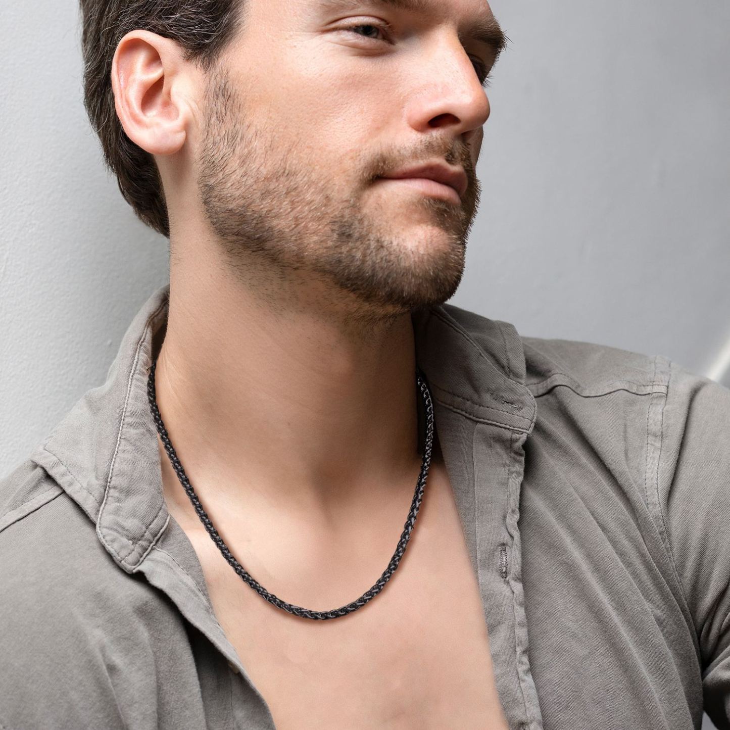 Men wearing black wheat chain necklace