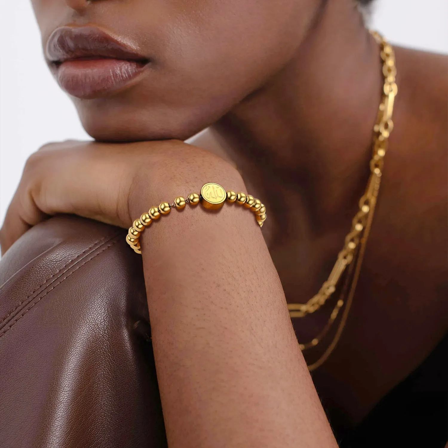 Women wearing gold beads bracelet