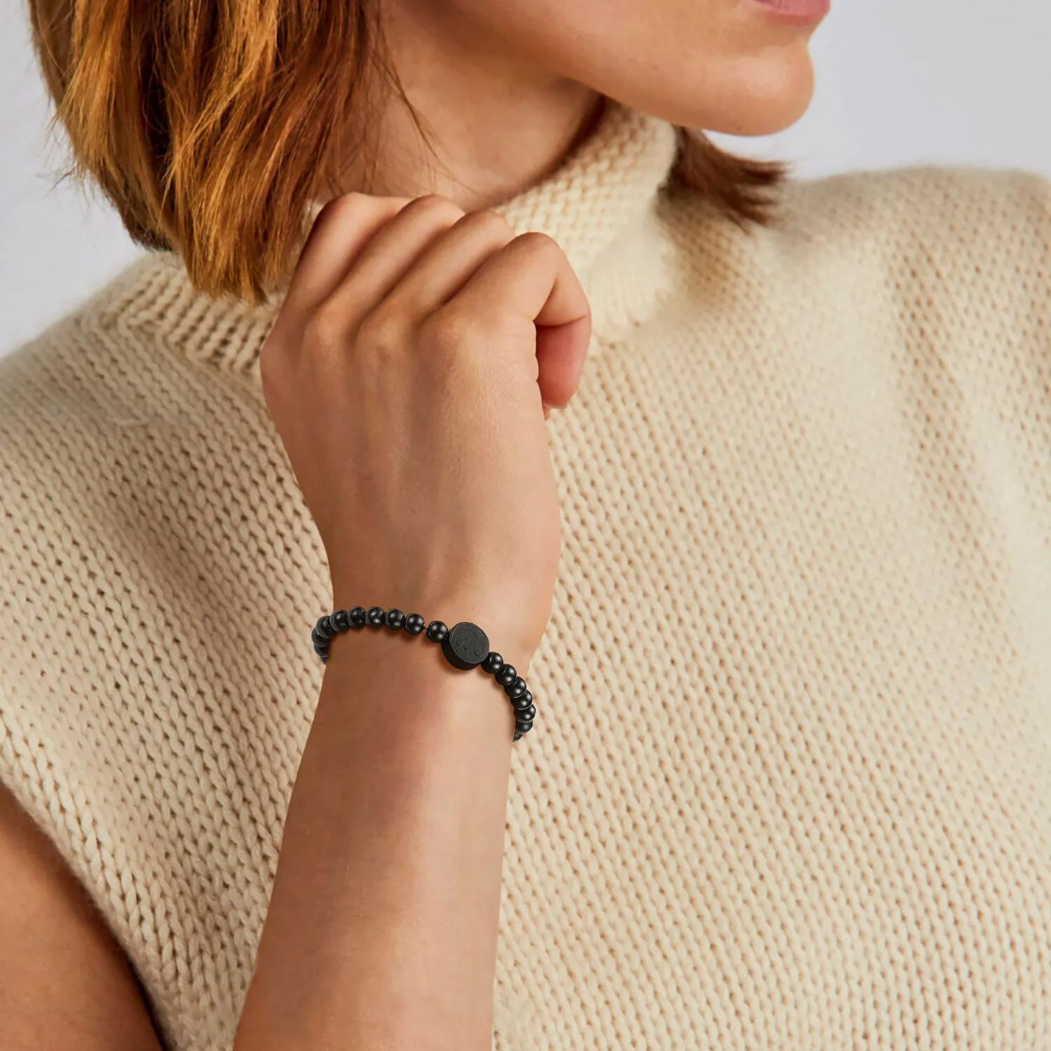 Women wearing black beads bracelet