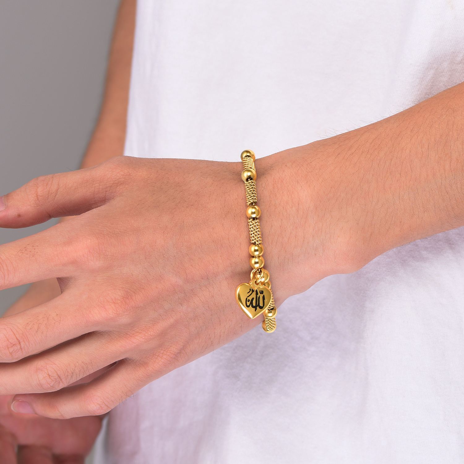 Gold Allah charm bracelet close up