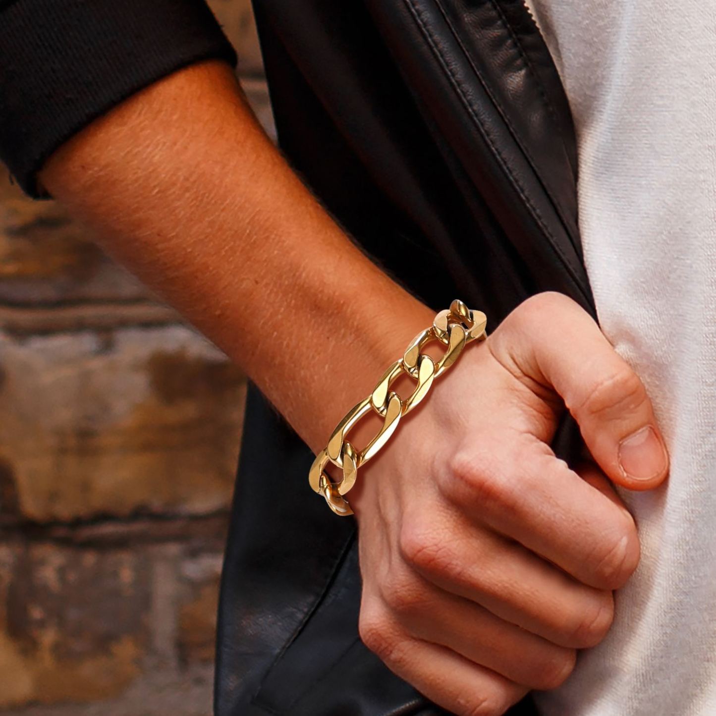 Men wearing a 13mm stainless steel figaro bracelet on wrist, casual everyday style
