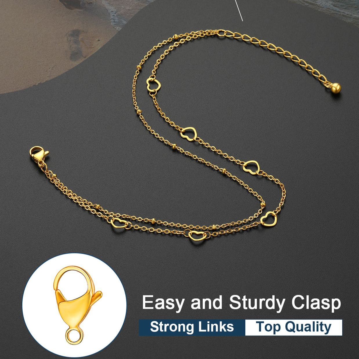 Gold double layer heart charm anklet with extension chain on dark background