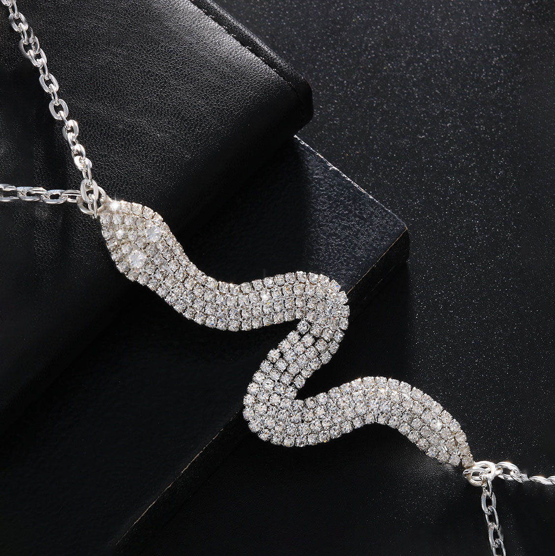 Sexy, sparkling serpentine rhinestone body chain