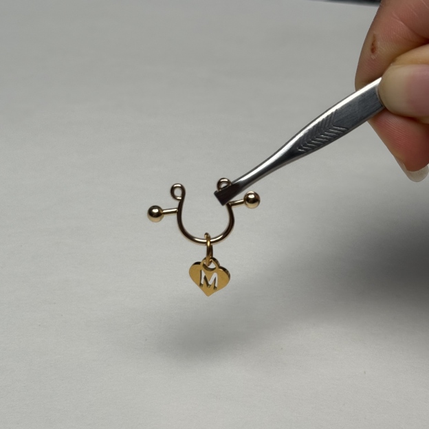 Custom letter nipple clamps