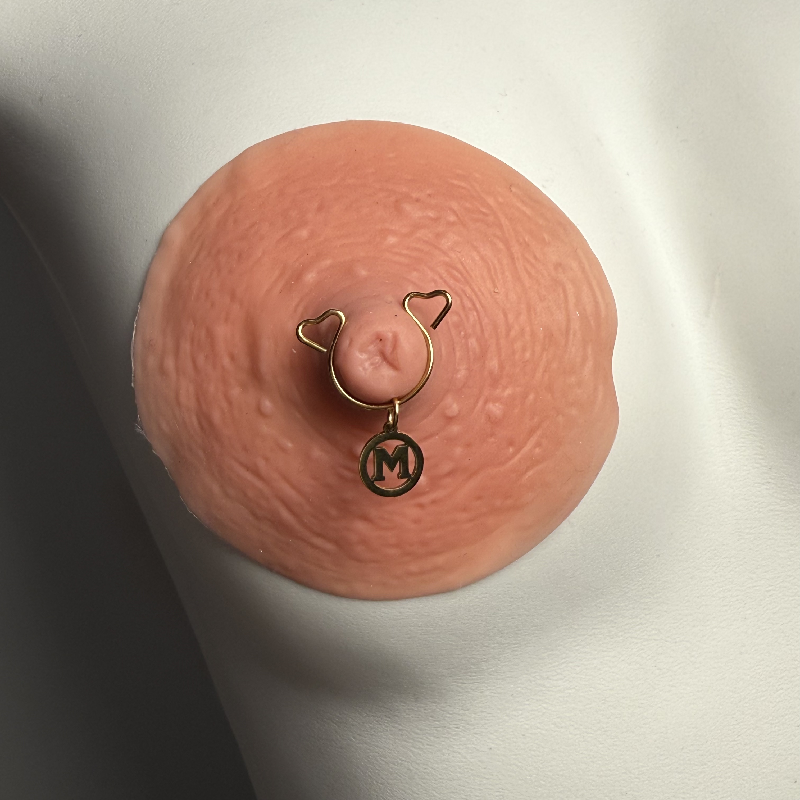 First letter nipple clamp