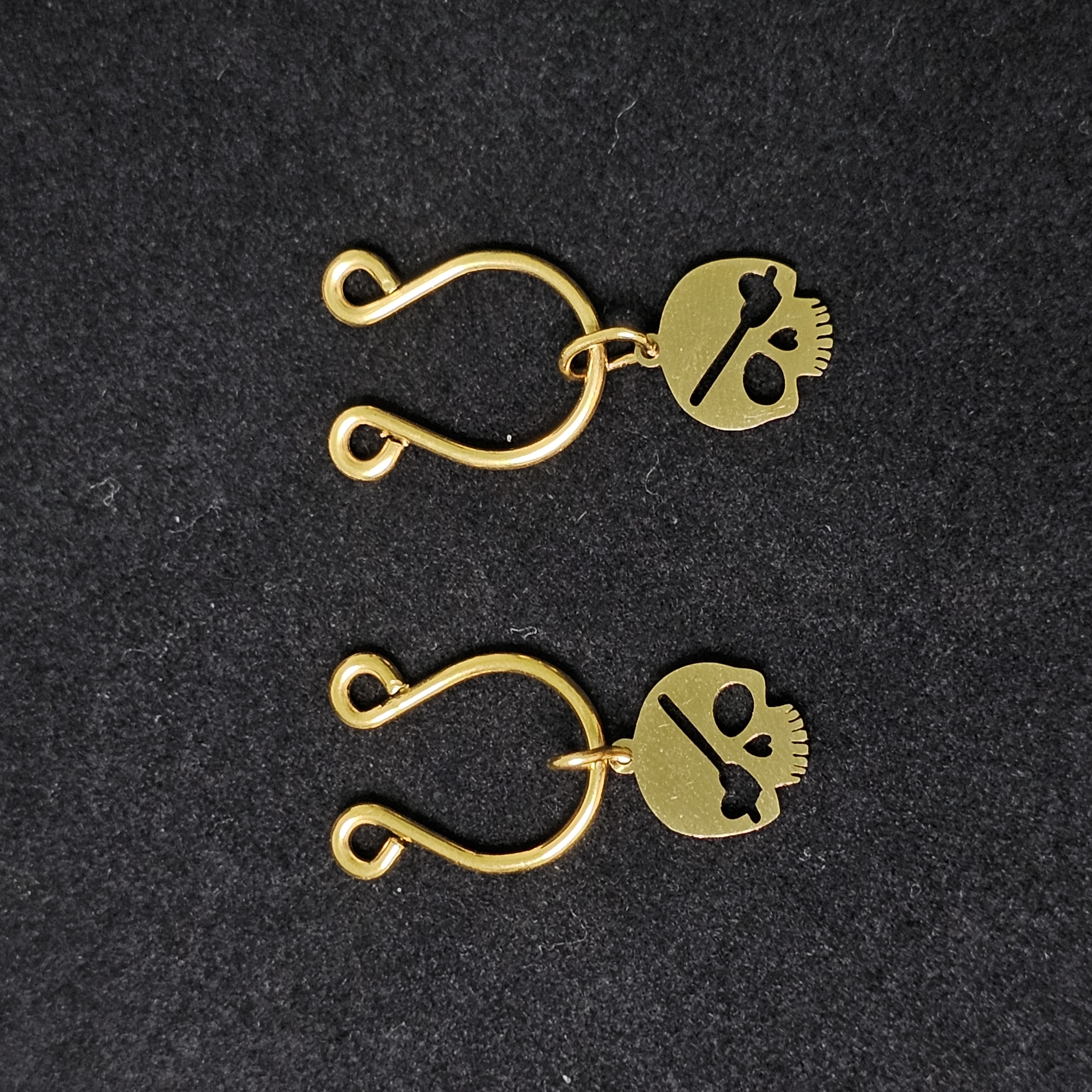 Gilded skull pendant