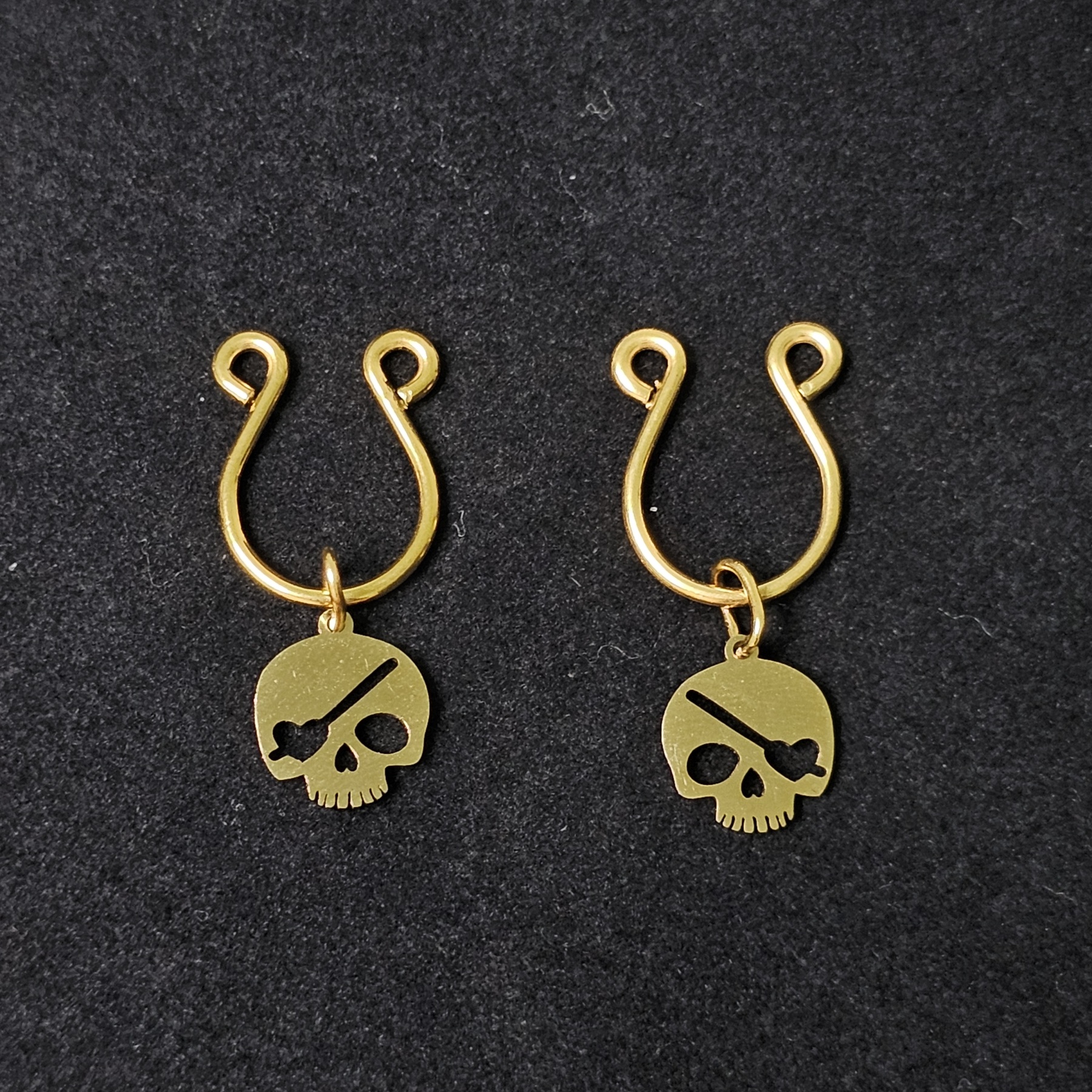 Gilded skull pendant