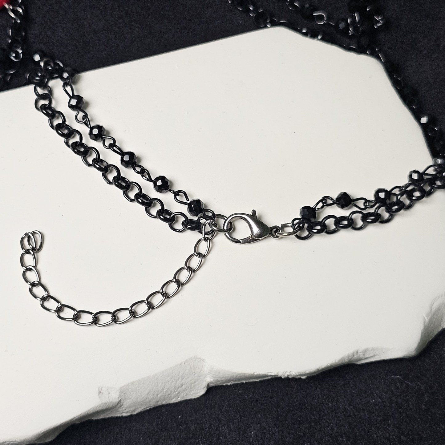 Black Chain Ruby Charm