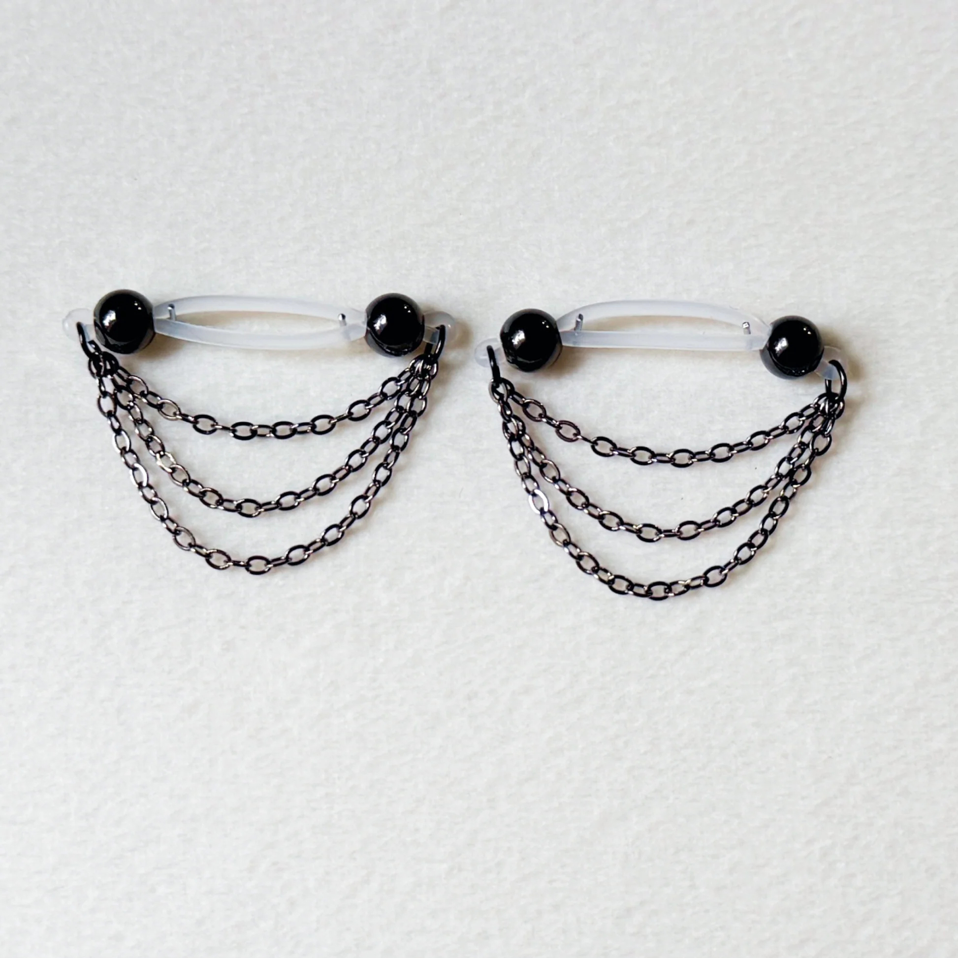 Black barbell nipple ring - triple chain