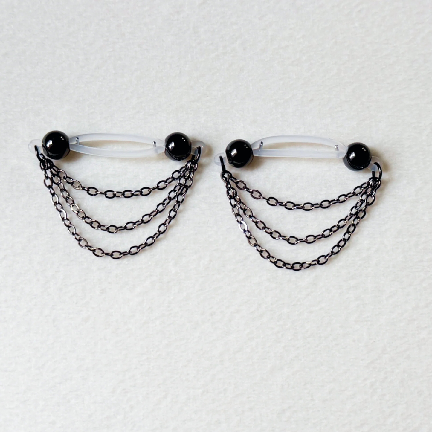 Black barbell nipple ring - triple chain