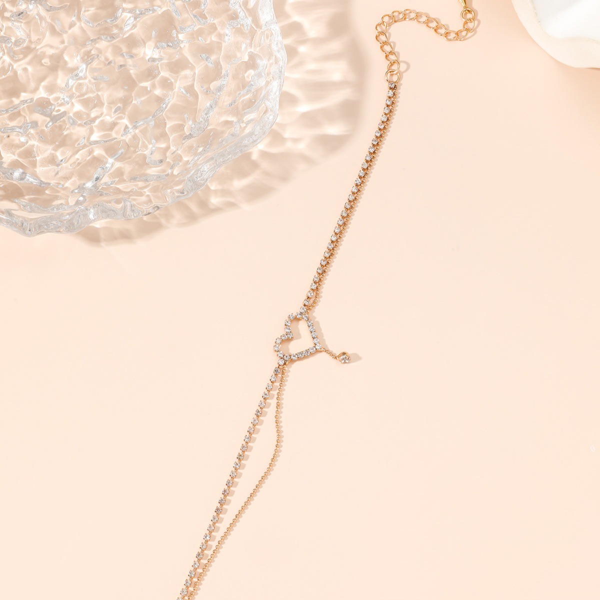 Diamond-encrusted heart-shaped anklet