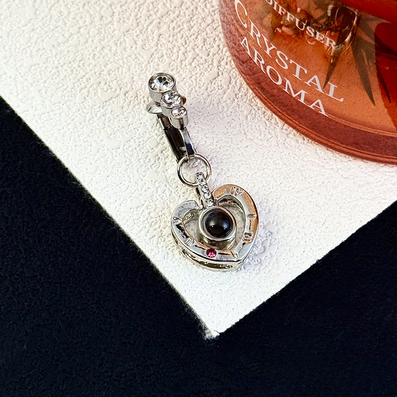Navel jewelry featuring "I Love You" in a hundred languages.