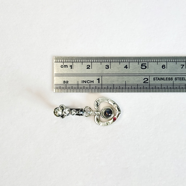 Navel jewelry featuring "I Love You" in a hundred languages.