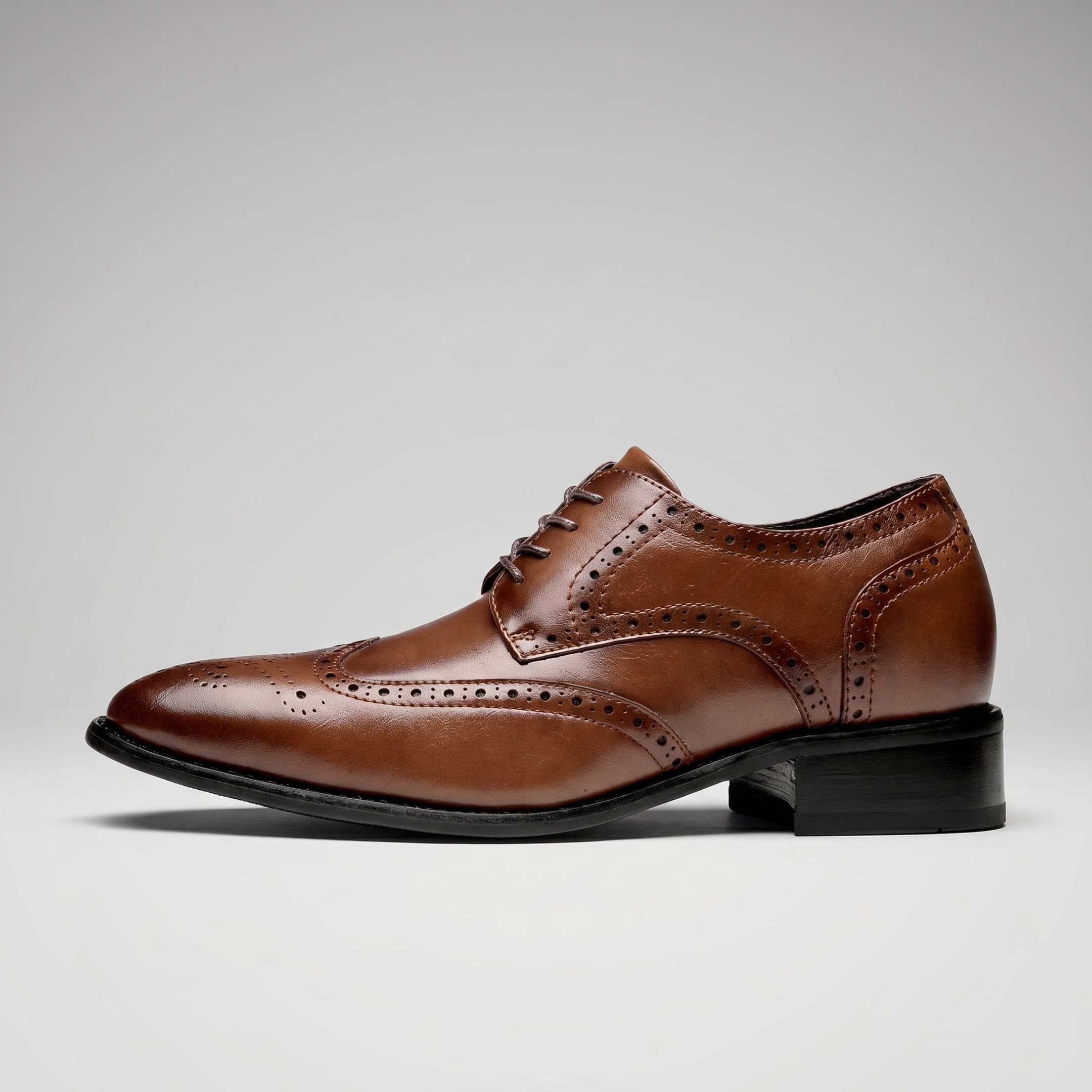 FORCIANO BROGUE brown Leather Height Increasing Shoes in a clean side profile, showing premium leather wingtip brogue detailing.