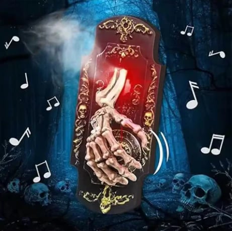 Skeleton hand doorbell used at a Halloween entrance