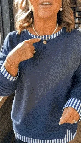 Animated view of the navy layered sweatshirt neckline, cuffs and hem