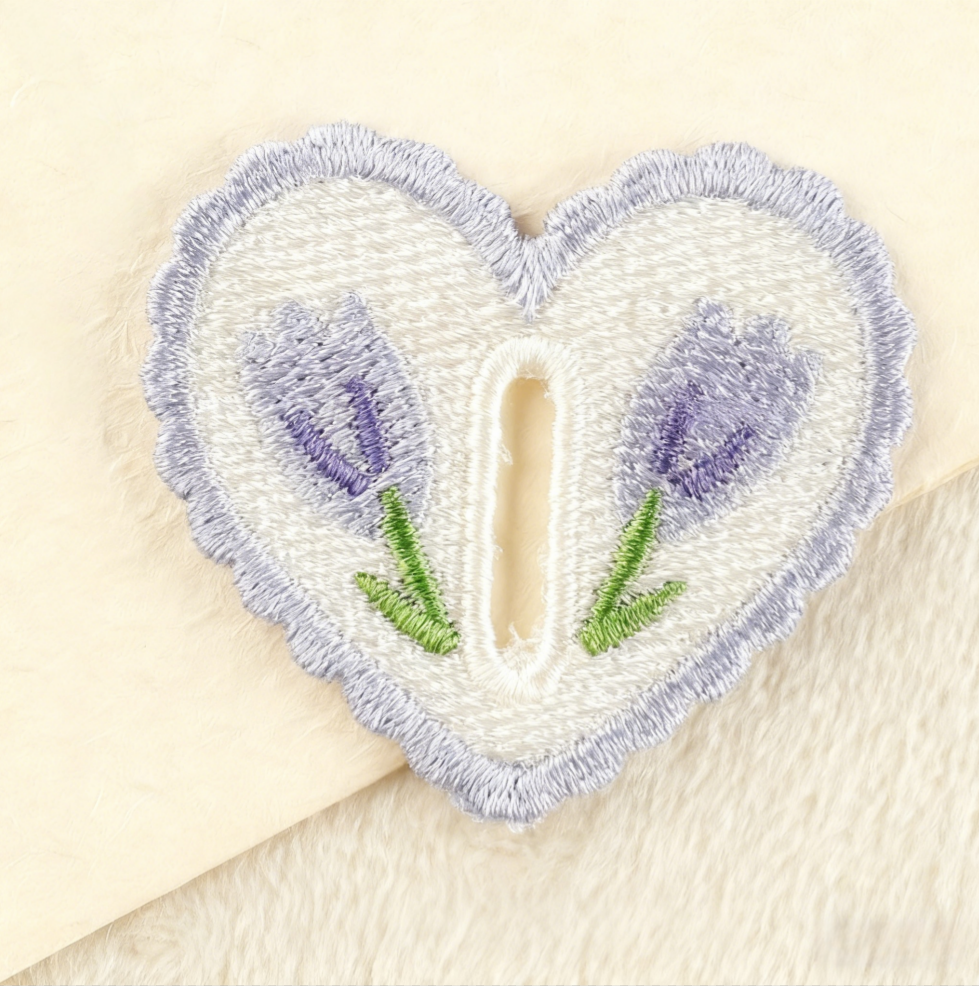 Hand-embroidered petal button hook decoration