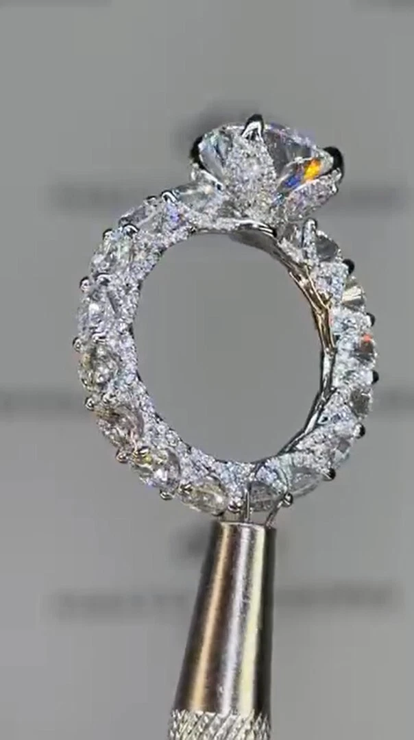 3-carat round halo-style U-shaped prong engagement ring