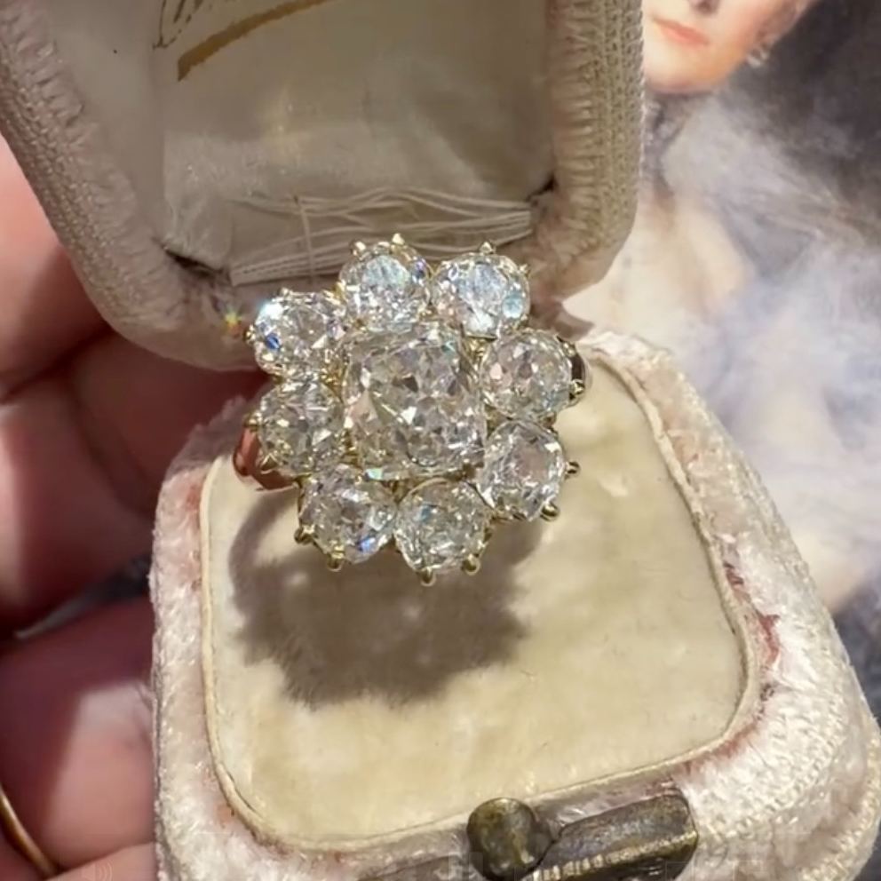 Floral-patterned round-cut white sapphire engagement ring