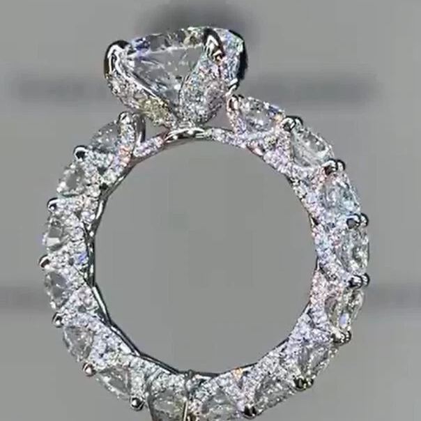 3-carat round halo-style U-shaped prong engagement ring