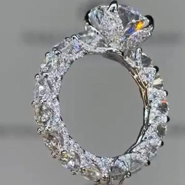 3-carat round halo-style U-shaped prong engagement ring