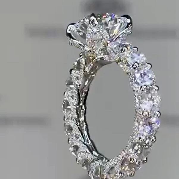 3-carat round halo-style U-shaped prong engagement ring