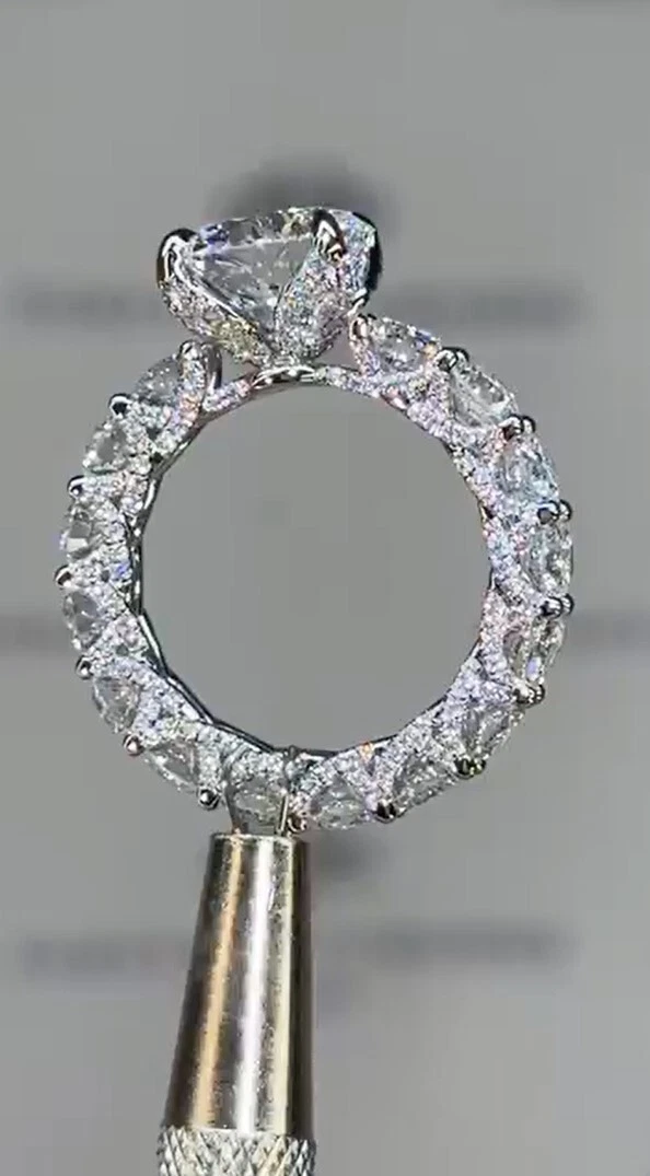 3-carat round halo-style U-shaped prong engagement ring